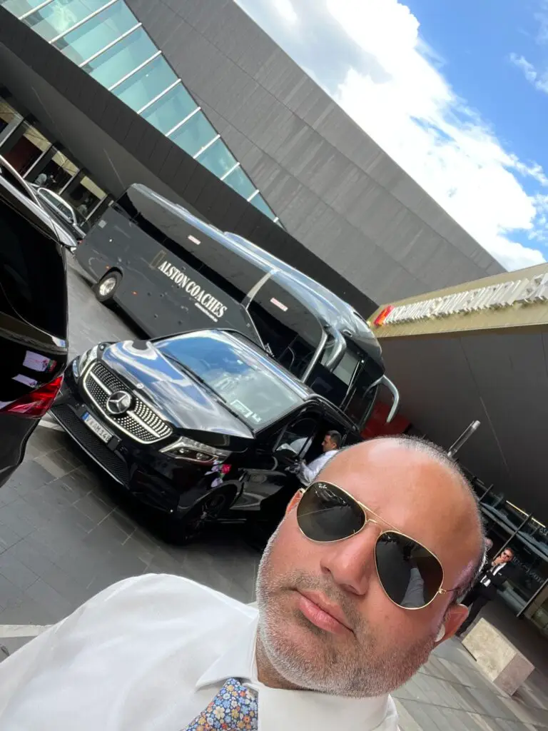 corporate luxury chauffeur Melbourne with luxury van and bus at airport terminal